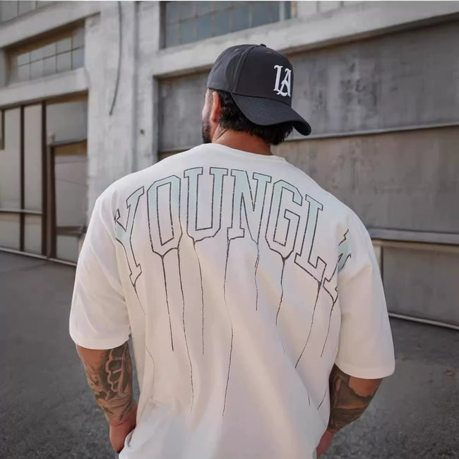 YoungLA Heavyweight Acid Wash Oversized Tee – Cream Drip Arc Back Artwork Hover Image